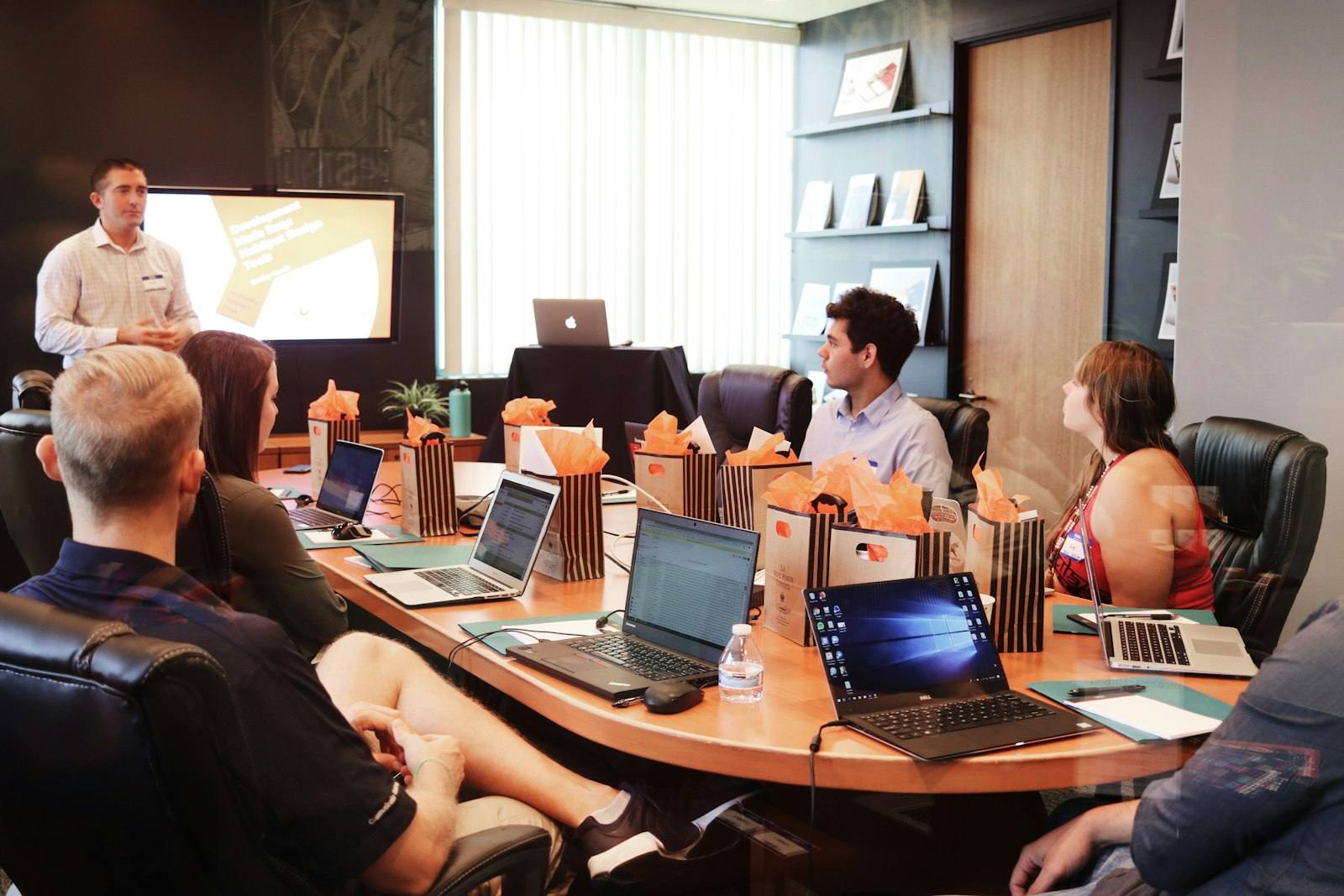A leadership team around a boardroom table