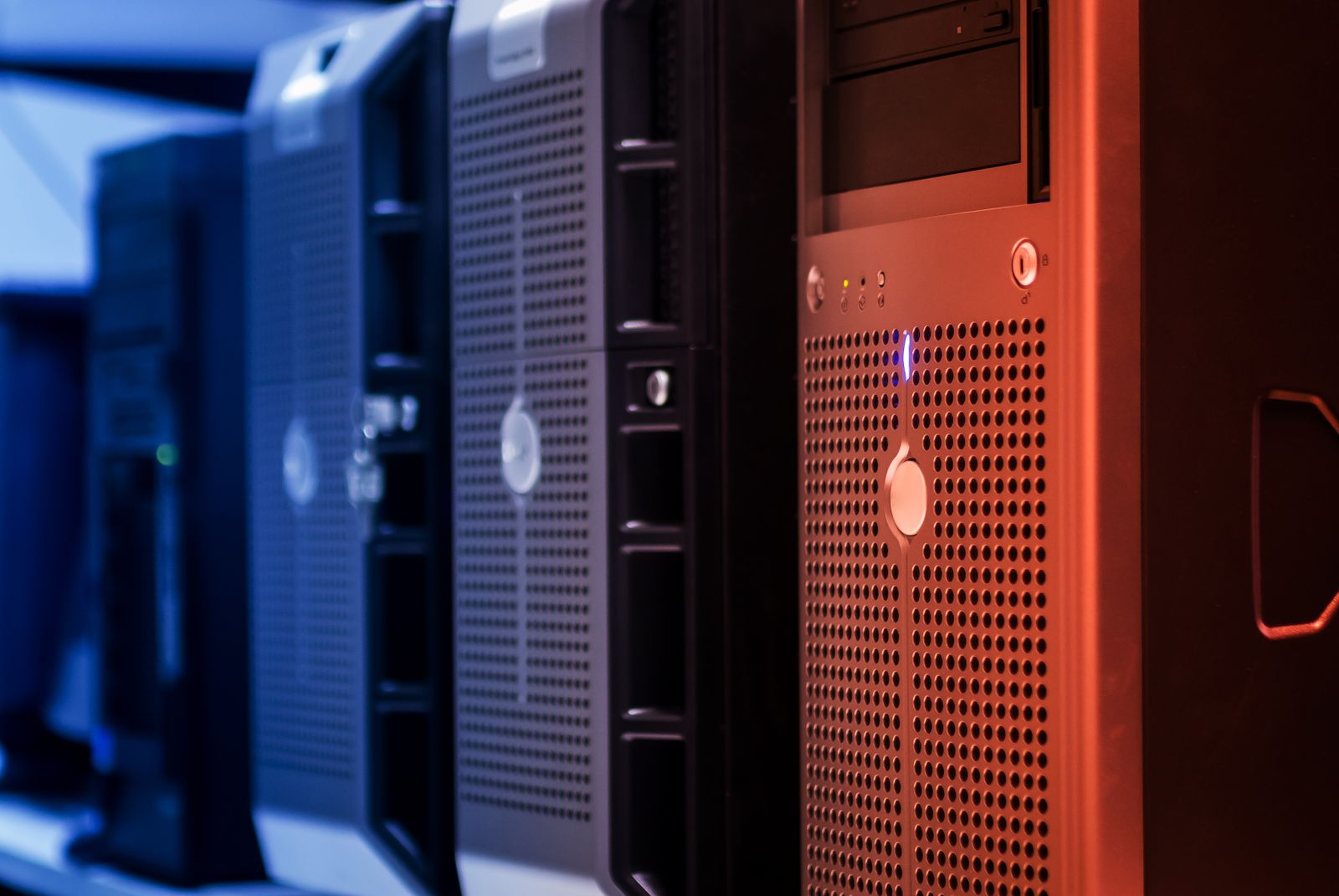 Server units racked in a row, lit in blue and red