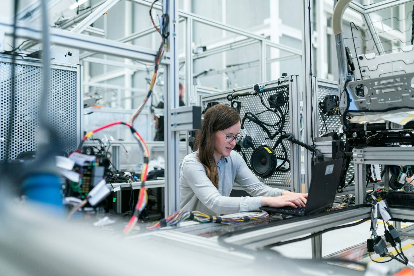 An engineer working at an industrial control station